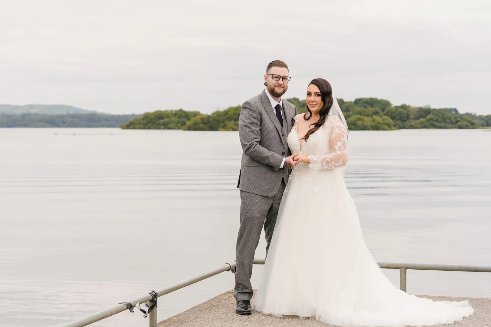 Bride and groom overlooking Lough Ramor at The Lakeside Manor, one of Ireland's most beautiful lakeside wedding venues.
